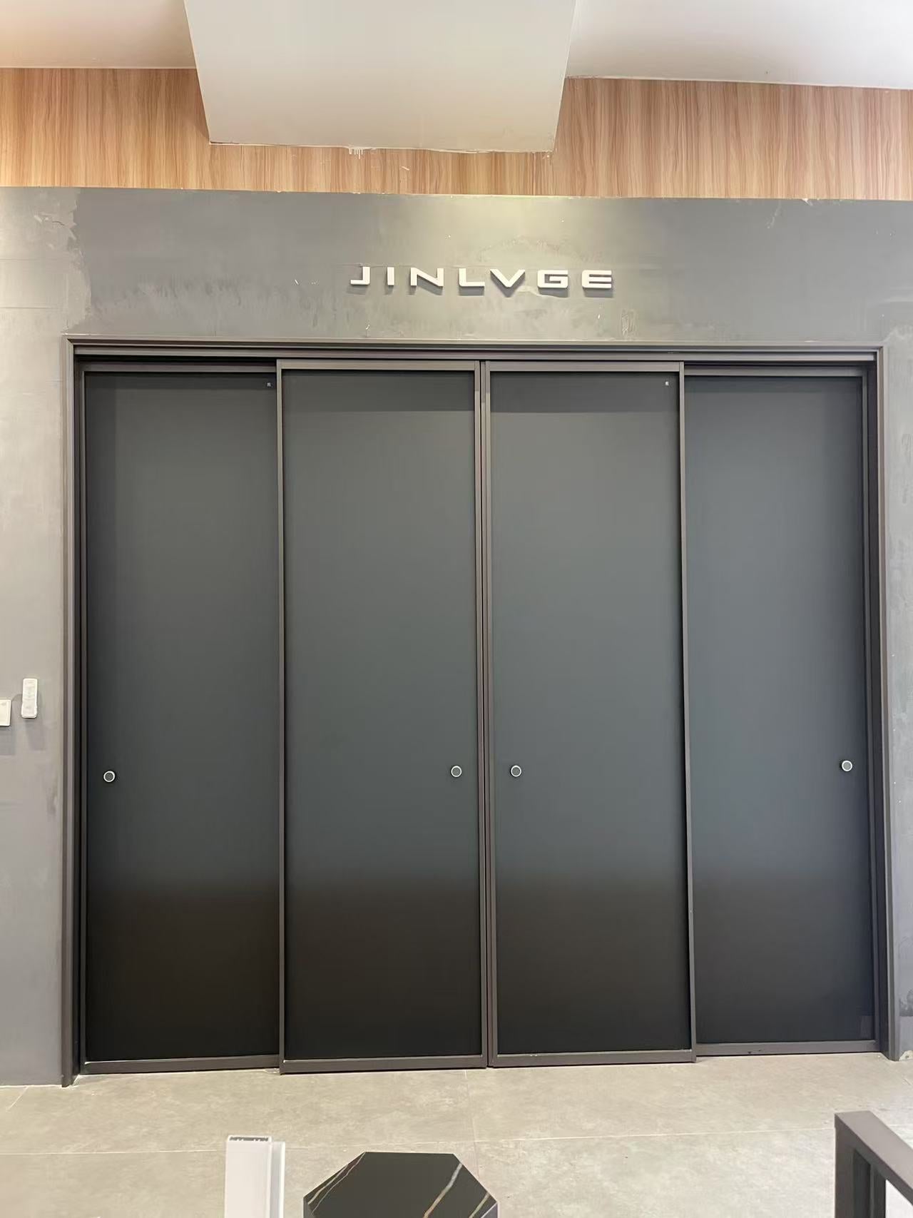 Intentional linkage two-track sliding door