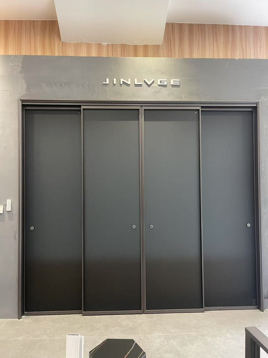 Intentional linkage two-track sliding door